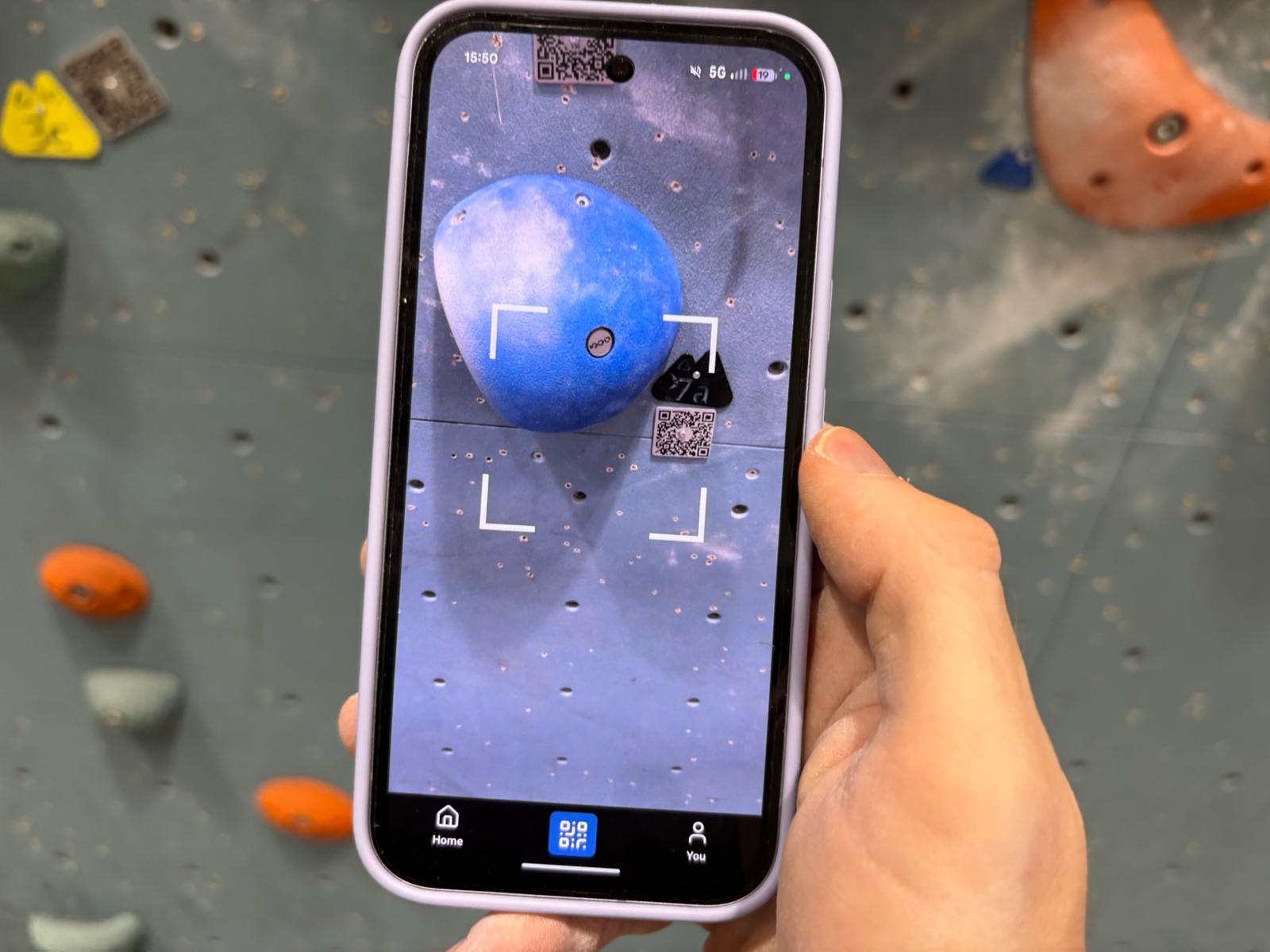Climber scanning a tag and viewing route on app